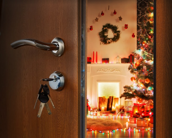 Set of keys hanging in a keyhole on Christmas time