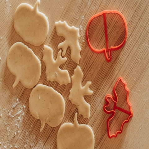 Halloween-shaped cookie dough and cookie cutters