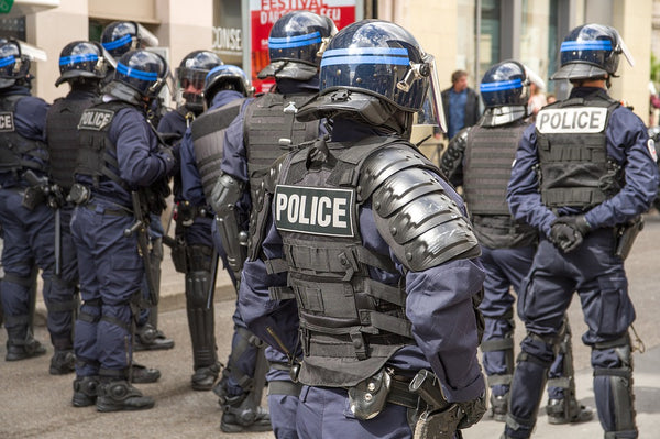 Group of police officers out on the streets wearing full body armor