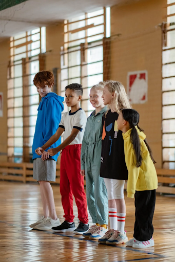 School children lined up in a room