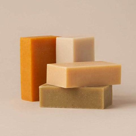 Four shampoo bars of all different colors. 