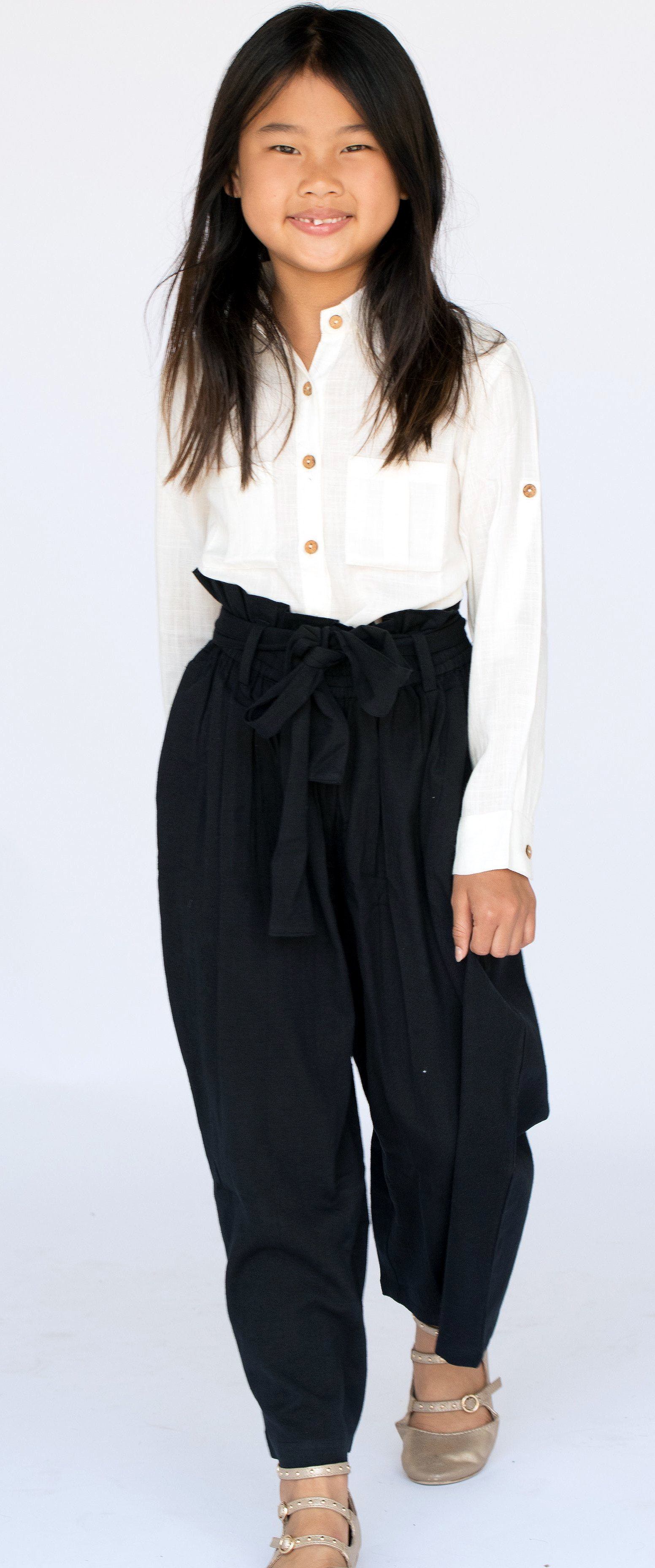 Dress up track pants with a buttondown then let it hang off your   Everything Theyre Wearing at Australian Fashion Week  POPSUGAR Fashion  Photo 21