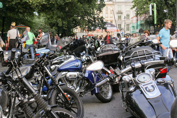 Group of Motorcycles Parked in Street