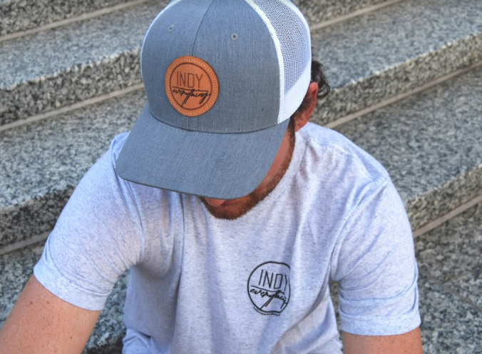 TRUCKER HAT - GRAY AND WHITE W/ LEATHER BADGE