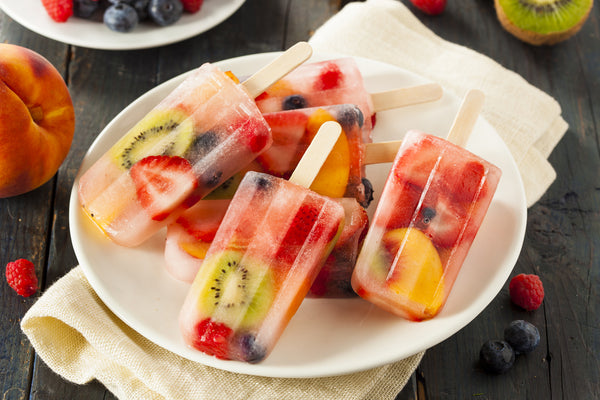 Fruit popsicles on a plate.