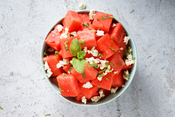 Watermelon, feta, and mint salad in a bowl.