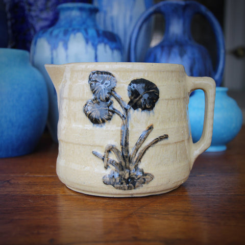 Robinson-Ransbottom Yelloware Milk Pitcher with Bas Relief Flowers and Strapping (LEO Design)