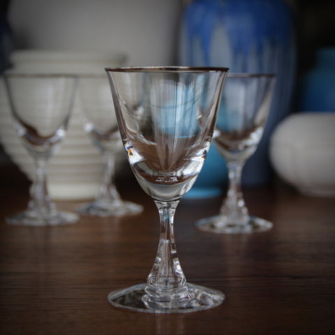 Set of Four Crystal Wine Glasses with Faceted Stems and Platinum Rims (LEO Design)