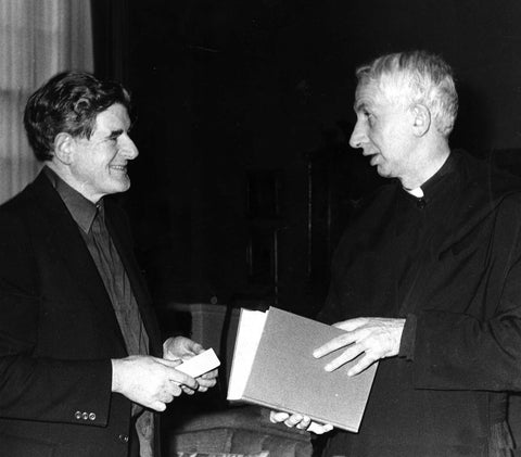 Austin presenting a specially bound copy of the Vatican II docs to Cardinal Basil Hume Archbishop of Westminister