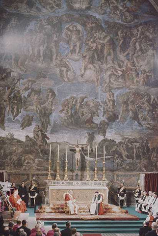 Archbishop Michael Ramsey of Canterbury and Pope Paul VI at the Vatican presiding together over a prayer service in the Sistine Chapel. They are seated side by side in front of the altar, with Michelangelo’s ‘Last Judgement’ towering over them.