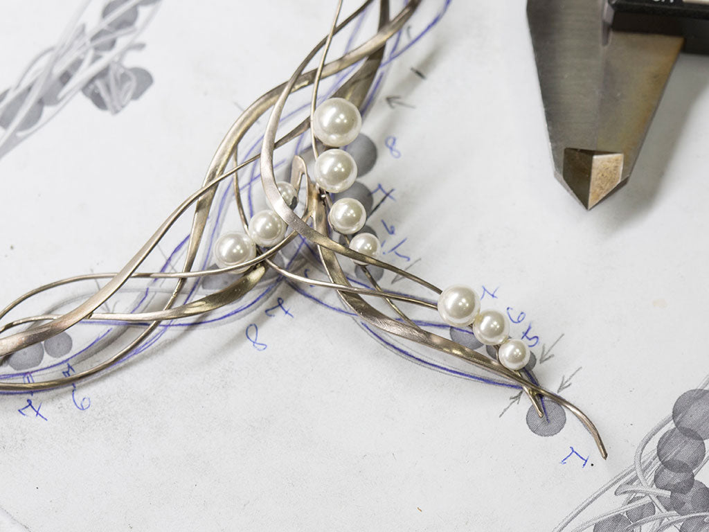 Hand made necklace madde of palladium content white gold, with white pearls and diamonds.