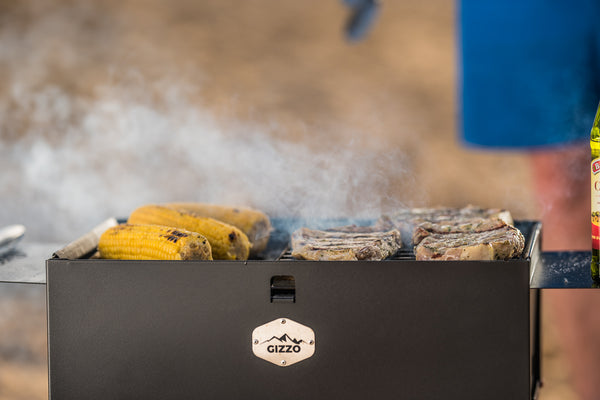 Cooking Steak on portable charcoal grill Gizzo