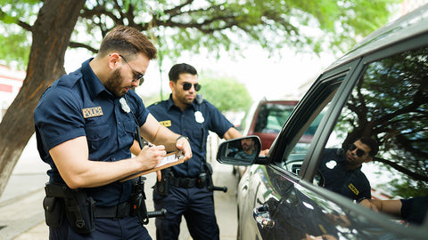 ticket being issued by law enforement officers