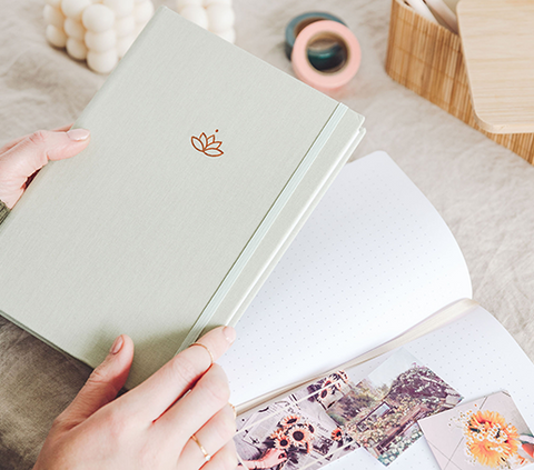 woman holding undated planner