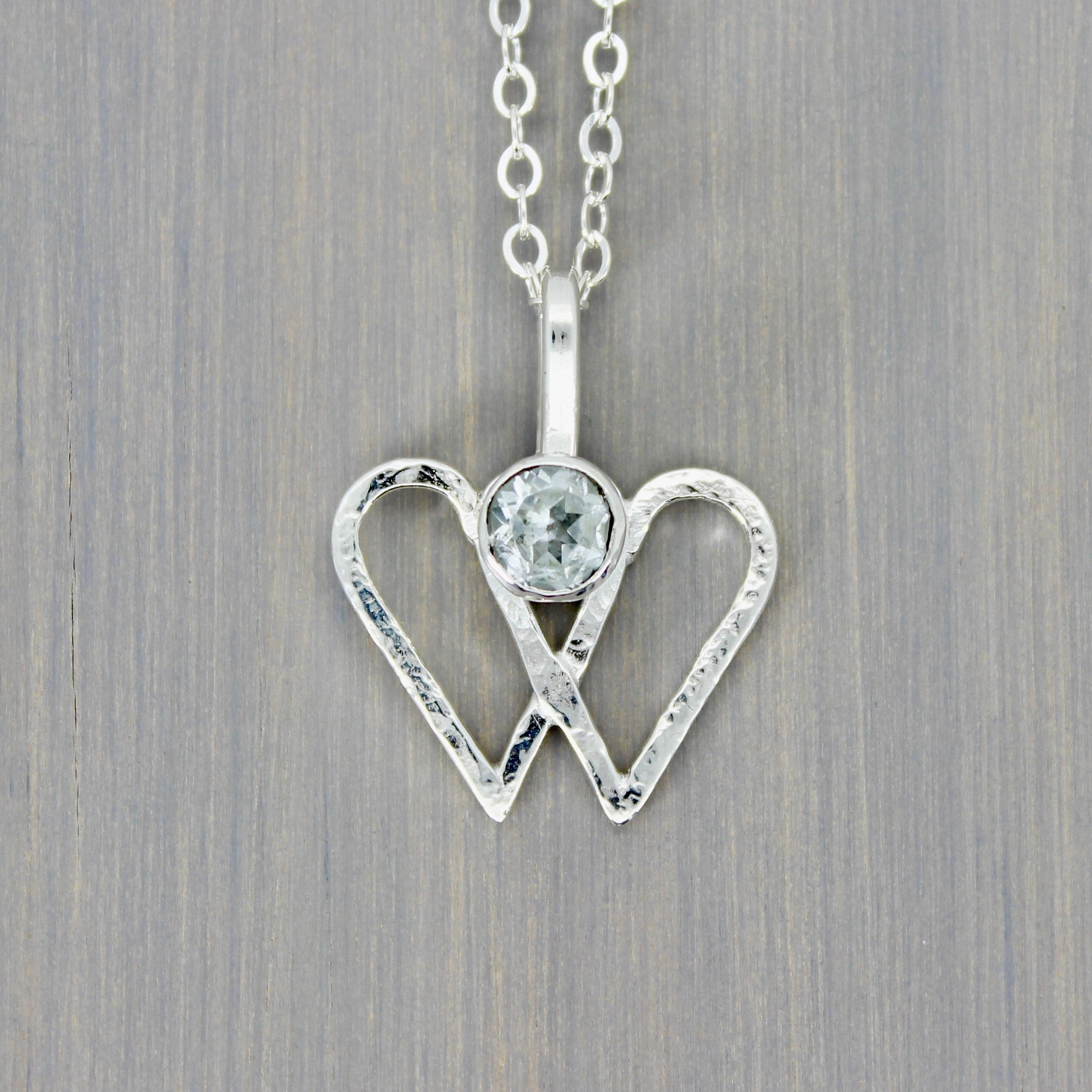 Double Heart Pendant with White Topaz