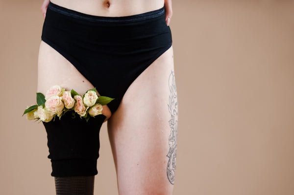 Model in black panties and prosthetic leg