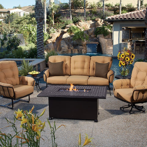 OW Lee fire pit centered in between OW Lee Patio Furniture near pool