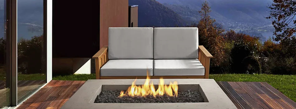 real flame baltic loveseat with a real flame fire pit table on a cliffside patio overlooking a valley