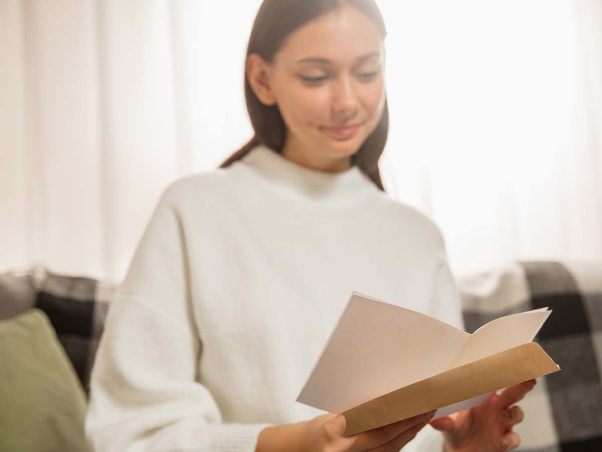 Woman reading a greeting card