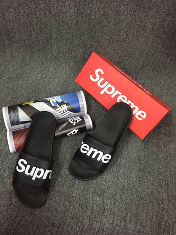 supreme flip flops white