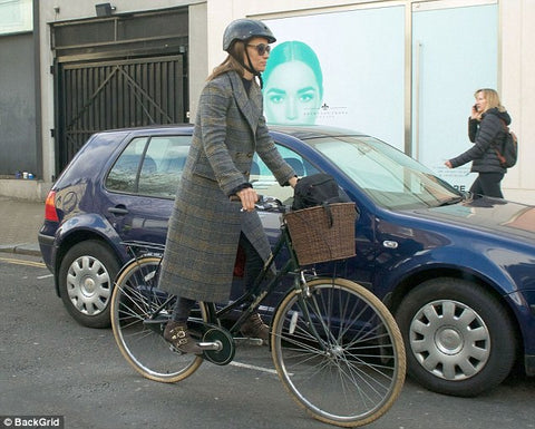 Pippa younger sister of Kate Middleton bikes through London 