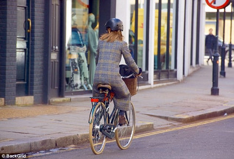 Pippa Middleton cycling away with Sawako black helmet 