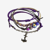 Anchor Bracelet 4 piece set is adjustable with stackable bracelets in purple, violet, brown cords, a bronze anchor charm and coconut beads. Sea life styled and stacked bracelets. Stack these corded bracelets. Created by O Yeah Gifts!