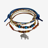 Elephant Bracelet 4 piece set is adjustable with stackable bracelets in blue, yellow and brown cords, a silver elephant charm and coconut beads. Fun styled and stacked bracelets. Stack these corded bracelets. Created by O Yeah Gifts!