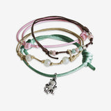 Octopus Bracelet 4 piece set is adjustable with stackable bracelets in pink and green cords a silver octopus charm and pearl beads. Sea life style stacked bracelets. Stack these corded bracelets. Created by O Yeah Gifts!