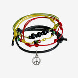 Stackable Peace Bracelet 4 piece set. Rasta red green yellow and black cord bracelets are adjustable. Displayed with a silver peace charm and black, wooden beads. Stack bracelets are handmade. Created by O Yeah Gifts!