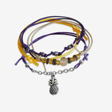 Stackable Pineapple Bracelet 4 piece set. Yellow and purple bracelet cords are adjustable. Displayed with a silver pineapple charm. Stack bracelets are handmade. Created by O Yeah Gifts!