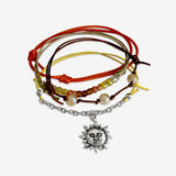 Stackable Sunshine Bracelet 4 piece set. Yellow and orange cord bracelets are adjustable. Displayed with a silver sun charm and beads. Stack bracelets are handmade. Created by O Yeah Gifts!