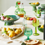 kitchen with green stemware