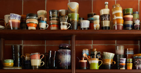 open shelving filled with retro inspired coffee cups and mugs