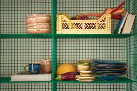 green open shelving with chef ceramics