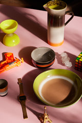 orange tabletop with a new retro style plate with bread