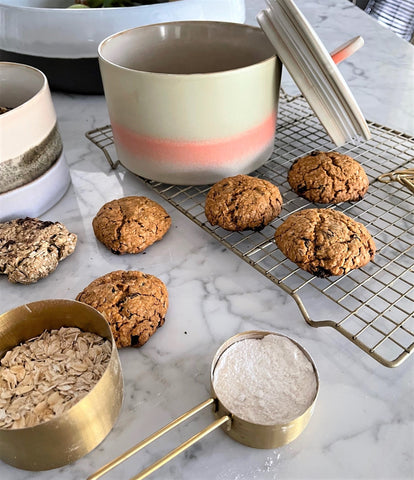 kitchen island with marble and oatmeal raisin cookies on baking sheet