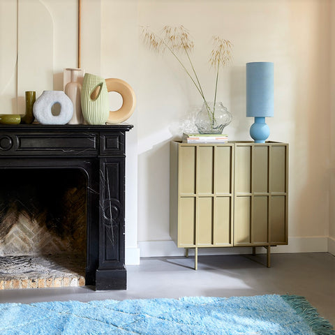 modern credenza with pastel blue table lamp