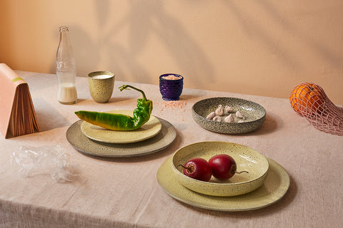 gradient ceramics with fresh fruit and vegetables on a table