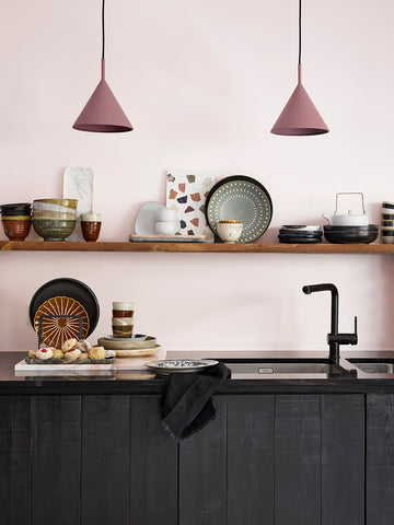 black kitchen with open shelving and two purple pendant lights