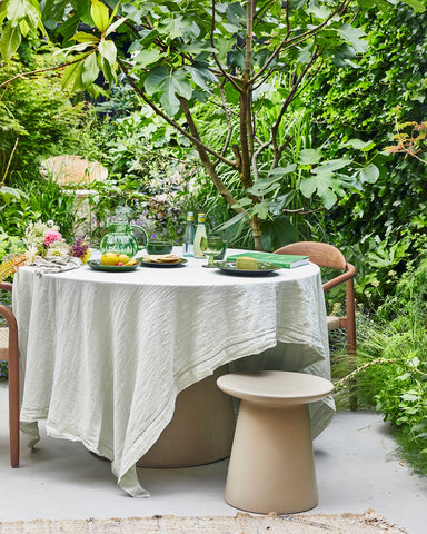 outdoor table setting in lush green garden