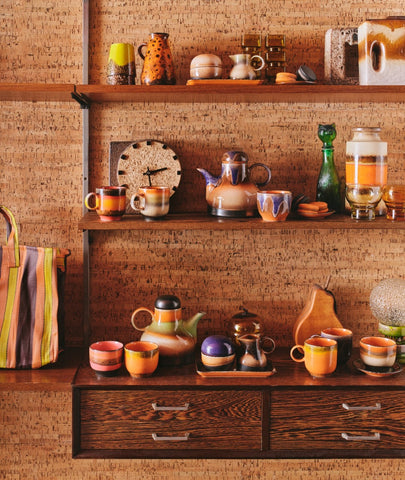 open shelving with retro style coffee cups, mugs and vases