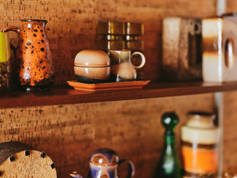 open shelving with sugar pot and milk jar in retro style brown hues