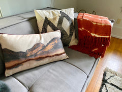 Hkliving pillows on couch in Woodstock way hotel
