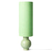 table lamp with stone ware base and linen shade in green tones