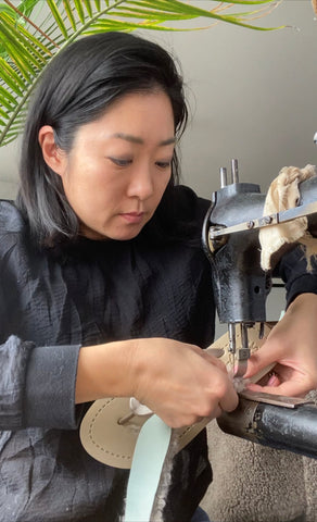 designer is making shoes at NYC studio