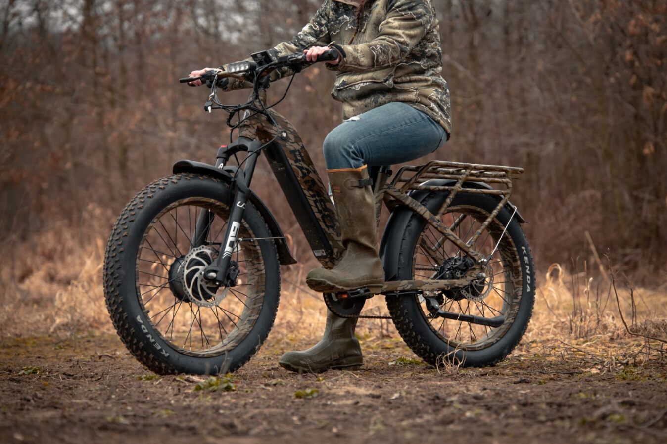 The Rambo Krusader 3.0 in Mossy Oak Bottomland with the rider sitting on the saddle, side profile