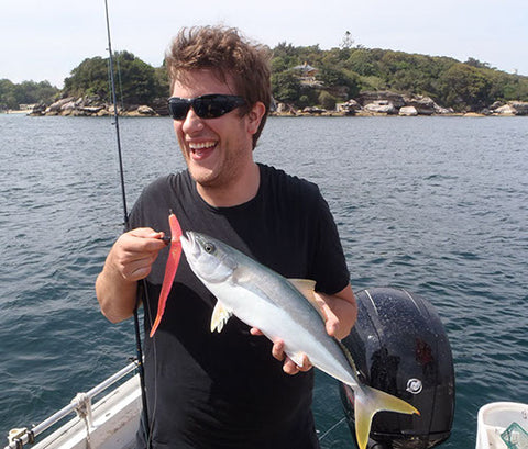 Ed catching a tiny Kingfish off the Tripod in Sydney Harbour on Soft Plastics