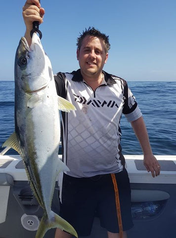 Dennis pulling in a nice kingfish on an upgraded reel