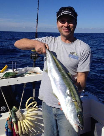 Marc with another Kingfish out on the water jigging